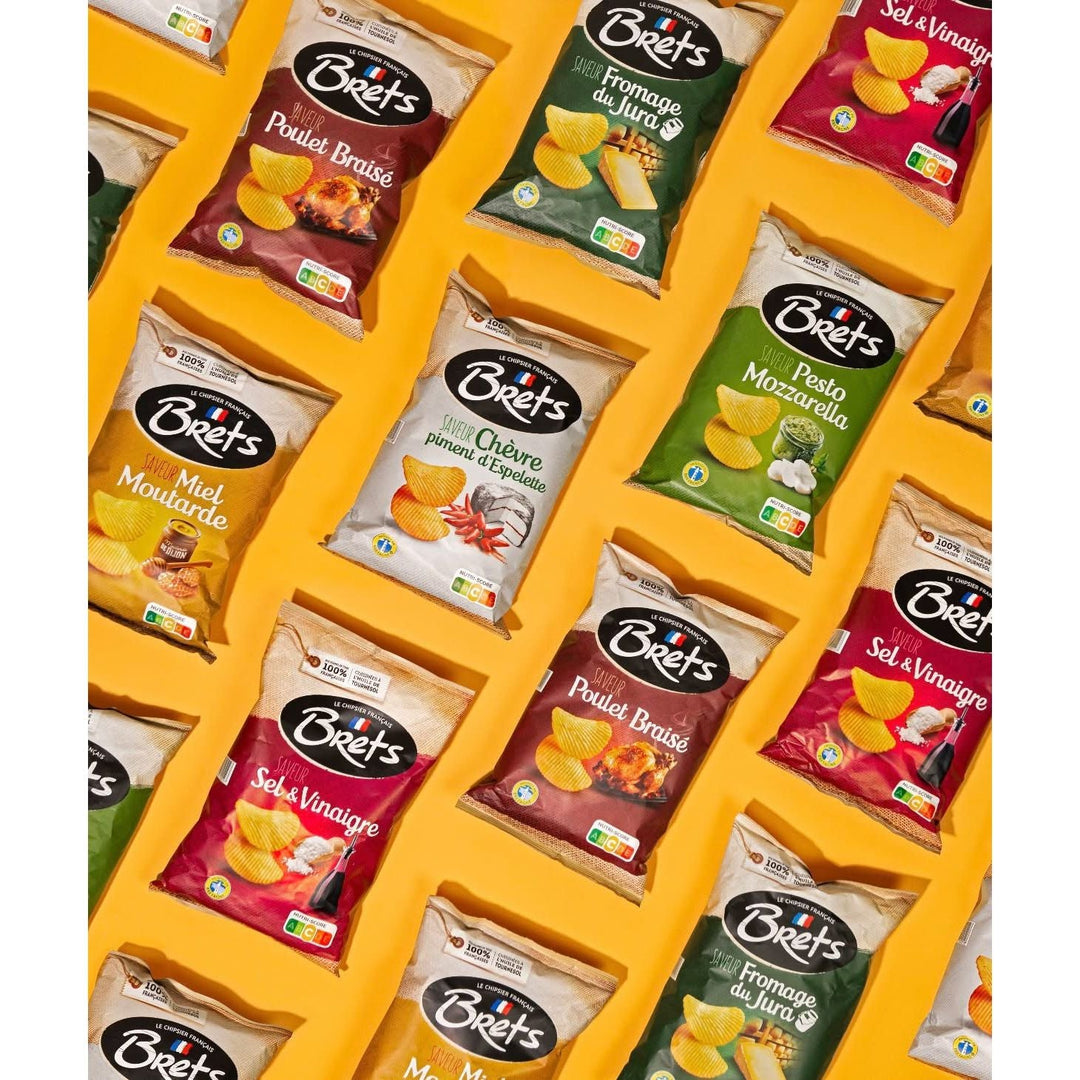 Bags of Brets flavored potato chips arranged diagonally on a yellow background