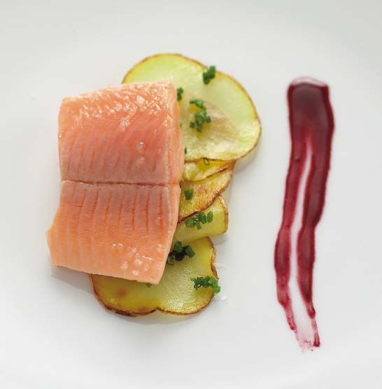 Salmon trout with crisp potatoes and blackberry raspberry-vinegar coulis