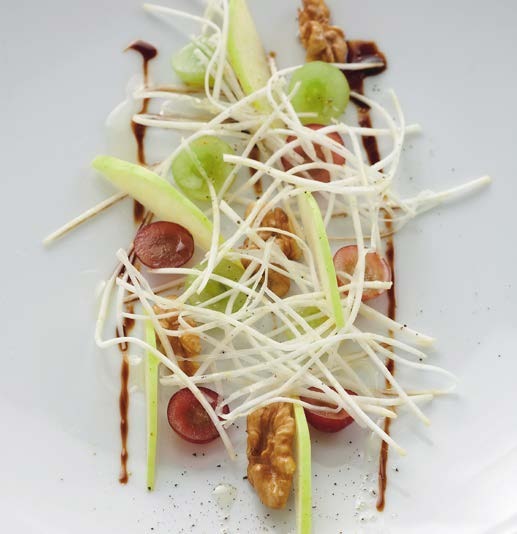 Elegant Waldorf salad with celeriac apples grapes walnuts and apple balsamic