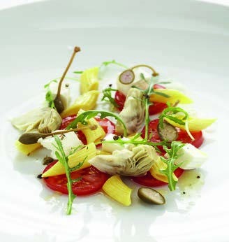 Mediterranean noodle salad with artichokes, tomatoes and arugula