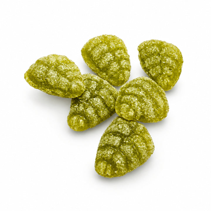 Loose Hermann the German hemp and lemon leaf hard candies on a white background