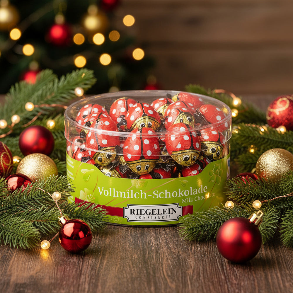 Riegelein 45-piece milk chocolate ladybug drum displayed in a holiday scene