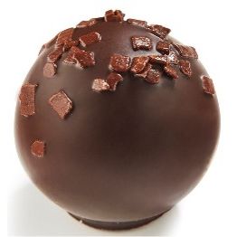 Ickx Sanna salted caramel praline with chocolate flakes on a white background