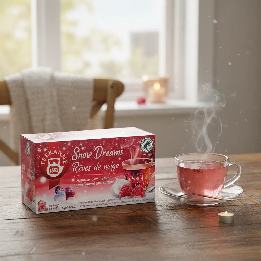 Teekanne Snow Dreams tea package with a festive design featuring a cup of tea and berries.