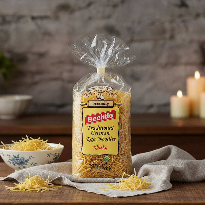 Bechtle Klusky egg noodle bag on a kitchen table with loose noodles