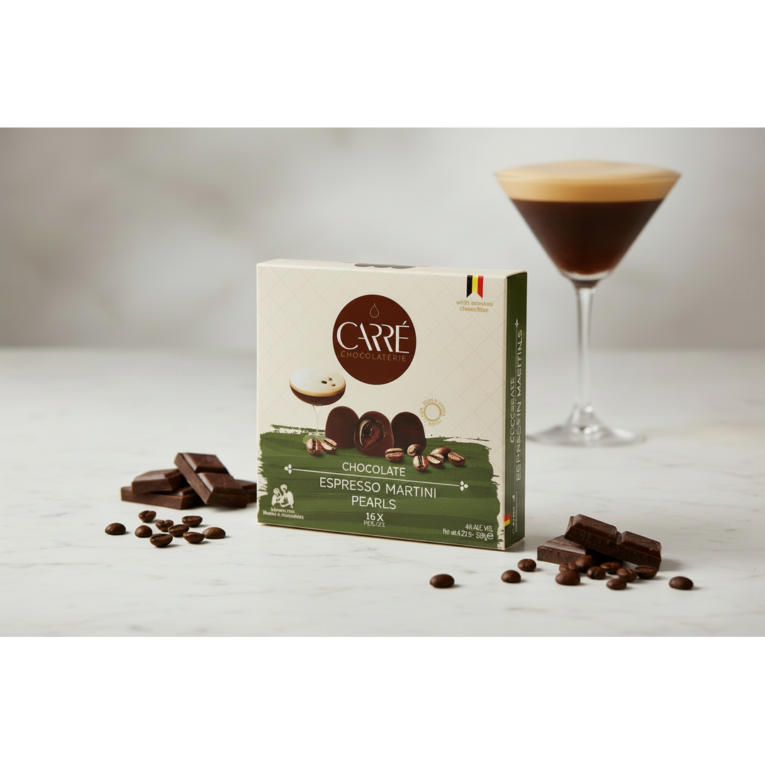 Box of Carre Chocolate Espresso Martini Pearls with a glass of espresso martini on a white background