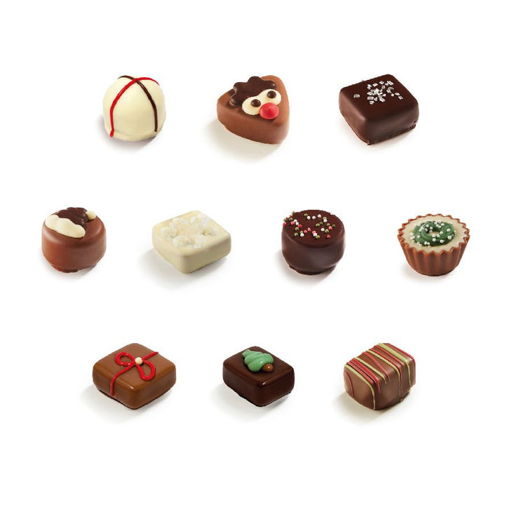 Nine Ickx decorated Christmas pralines arranged on a white background