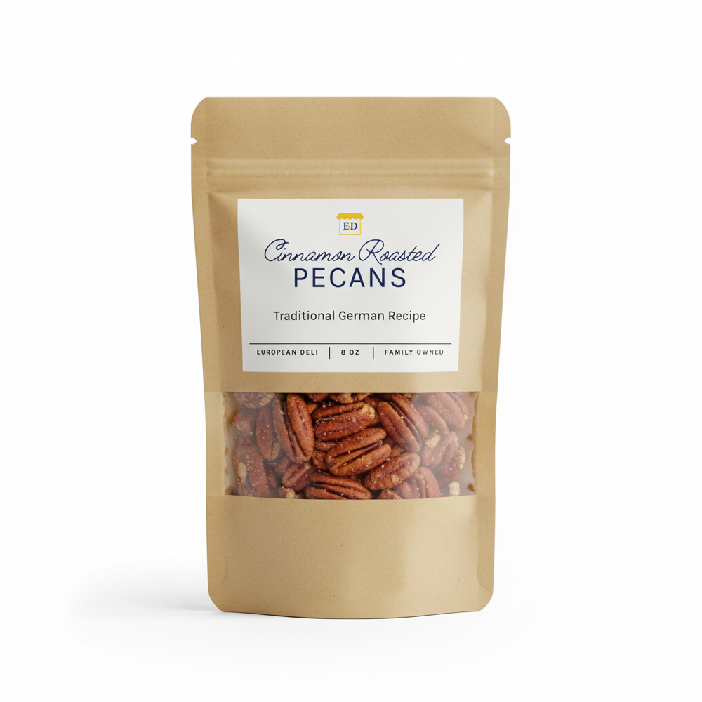 Bag of cinnamon roasted pecans with a label on a white background