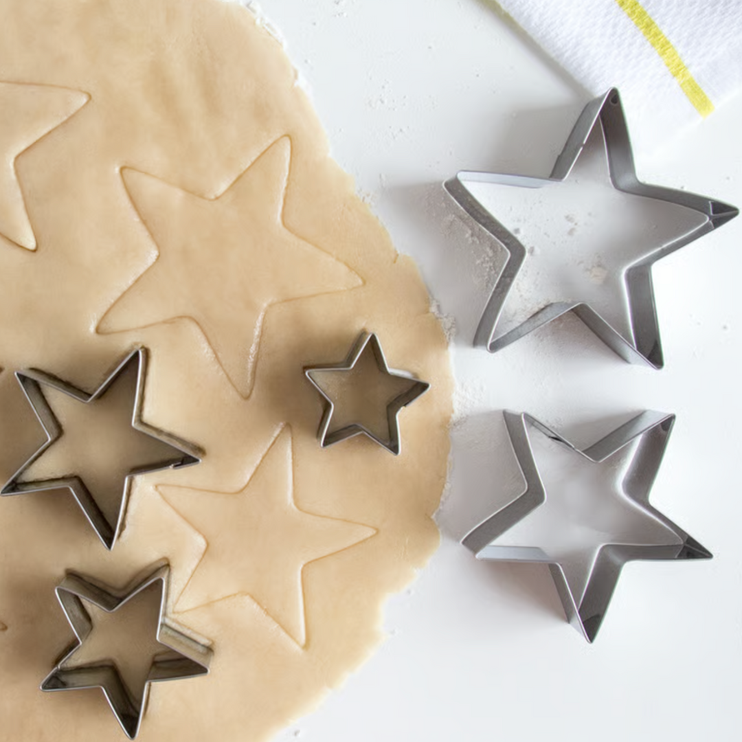 Fox Run 5-piece star cookie cutter set on rolled dough