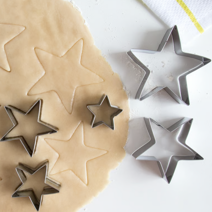 Fox Run 5-piece star cookie cutter set on rolled dough