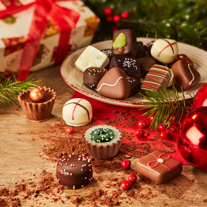 Ickx decorated Christmas pralines arranged on a festive table