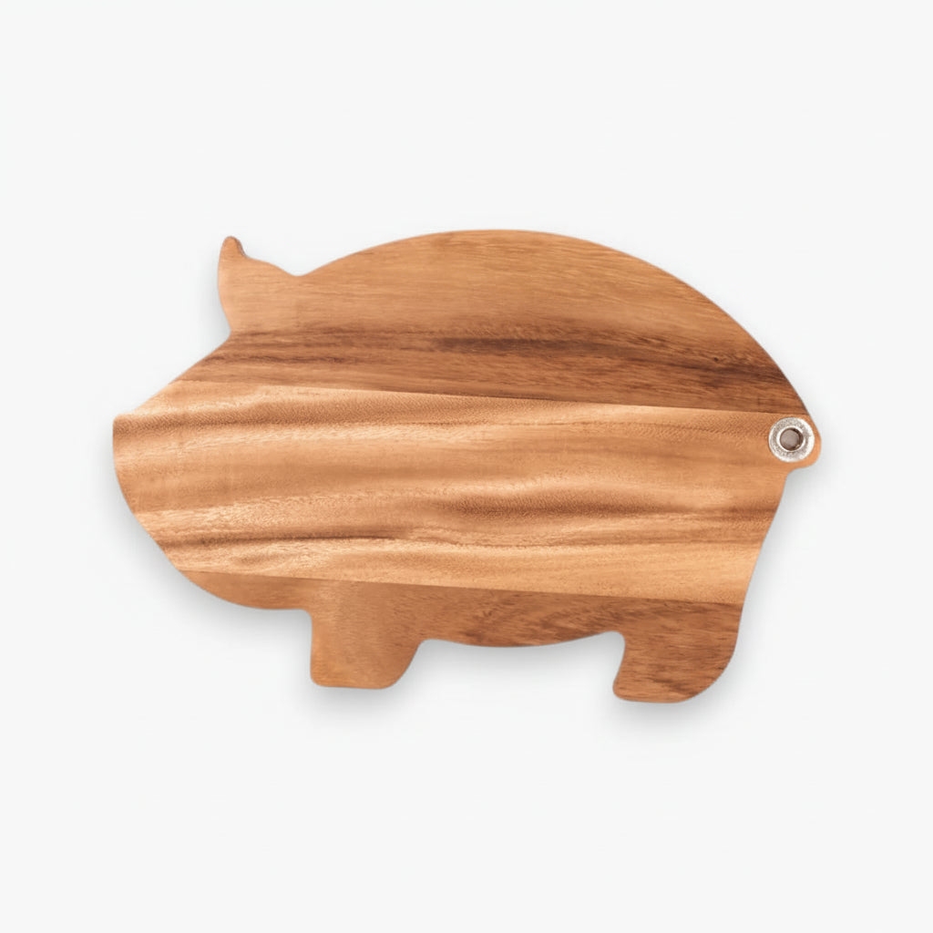 Wooden pig-shaped cutting board on a white background