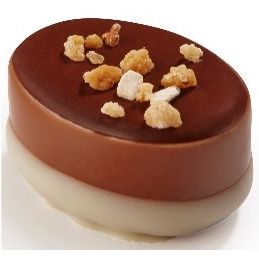 Ickx Cognac Caramel praline with a pale base and chopped nut topping