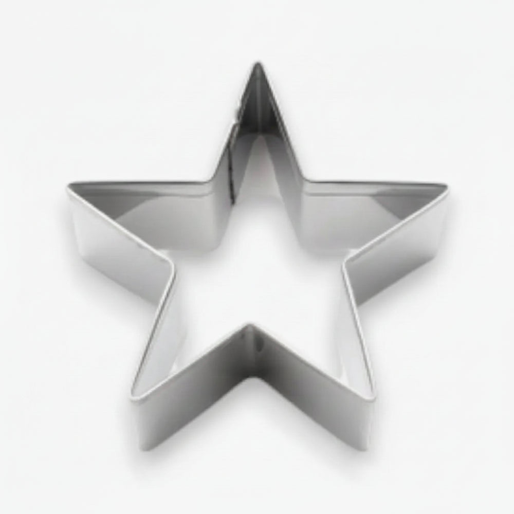 Metallic star-shaped cookie cutter on a white background