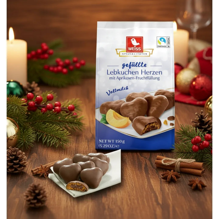 Weiss milk chocolate gingerbread hearts with apricot filling in a holiday scene