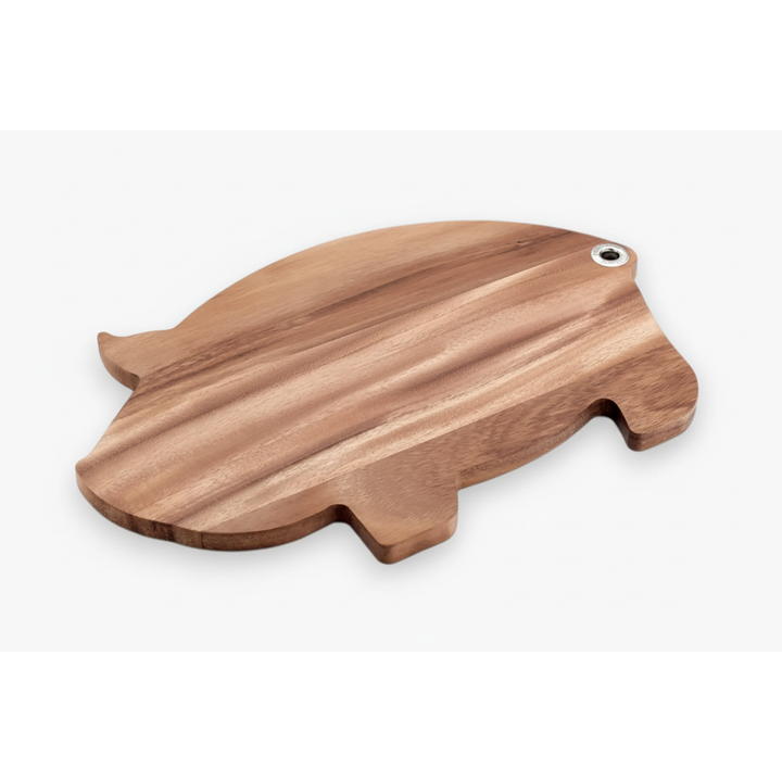 Wooden pig-shaped cutting board on a white background
