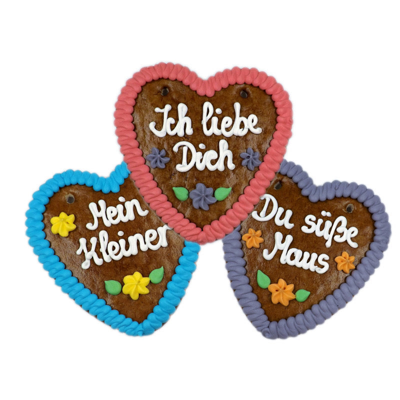 Three colorful German gingerbread hearts with sayings