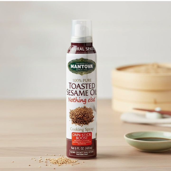 Mantova toasted sesame oil spray, 147 ml bottle beside a bamboo steamer