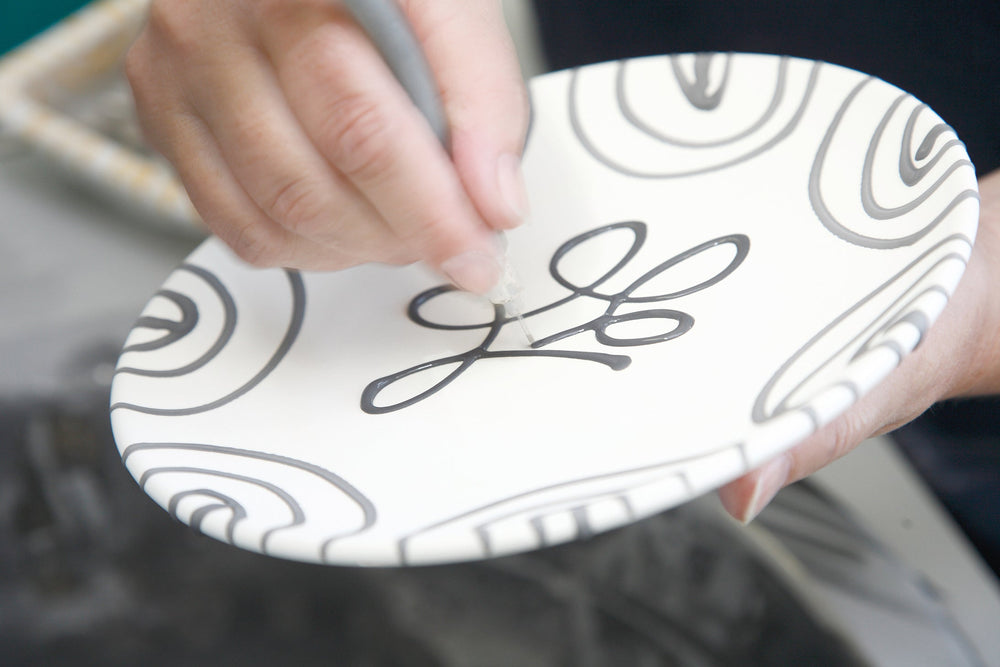 Gmundner Keramik artisan decorating ceramic tableware