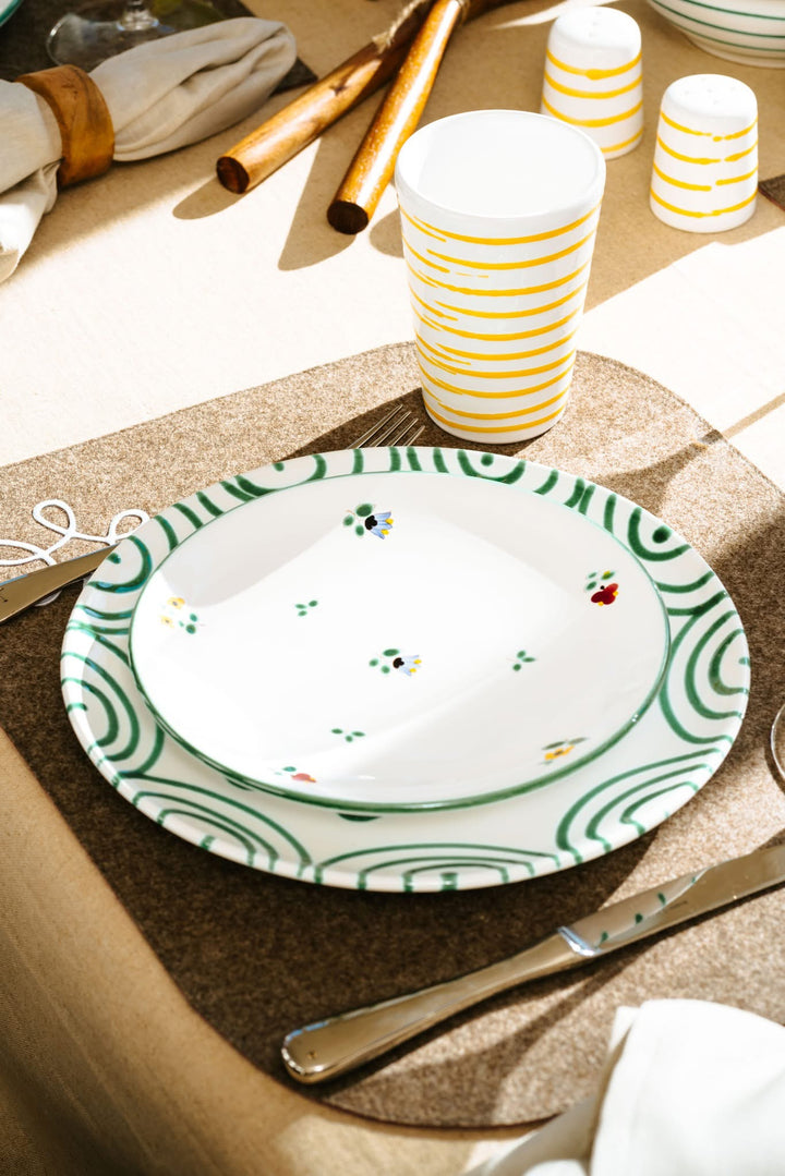 Green flamed dinner plate layered with an Alpine Flowers dessert plate; pieces sold separately