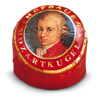 Individually wrapped Hofbauer dark chocolate Mozart Ball in red foil