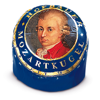 Individually wrapped Hofbauer milk chocolate Mozart Ball in blue foil