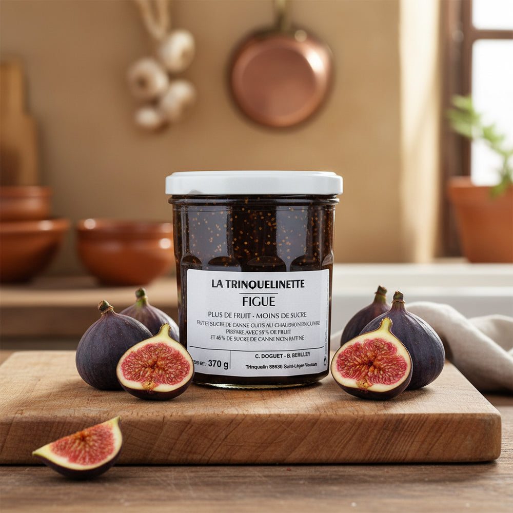 La Trinquelinette Fig Jam jar with fresh figs in a kitchen scene